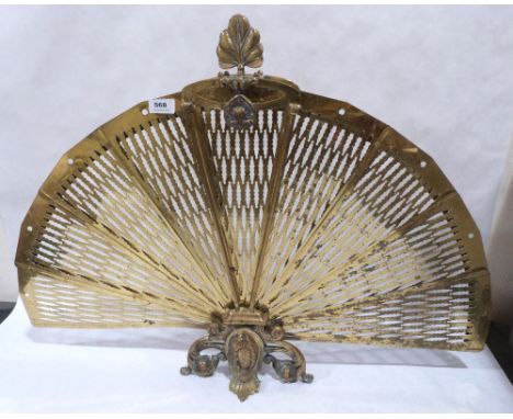 A brass peacock fireguard