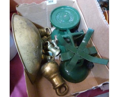 A set of weighing scales with brass weights