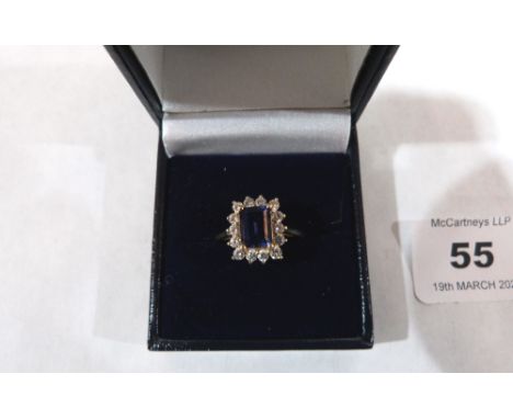 A sapphire and white stone cluster ring. In gold marked 585. 3.4g gross. Size S