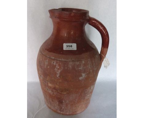 A Bridgwater earthenware pitcher. 14' high. Prov: Estate of Islwyn Watkins