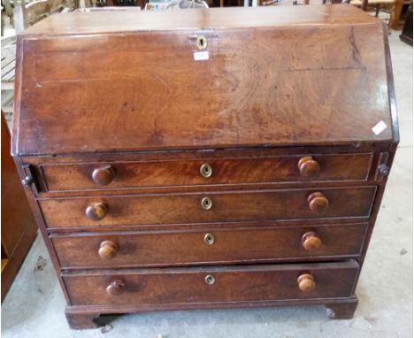 A George III mahogany writing bureau, the sloping fall over four long drawers on bracket feet