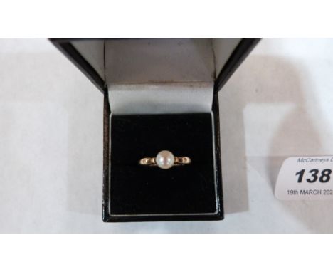 A pearl ring. In gold marked 14K. 2.5g gross. Size L