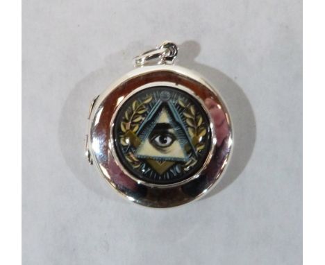 A silver fob pill box with masonic enamel decoration. 1' diam.
