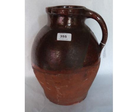 A 19th century salt glazed earthenware pitcher. West Country. 13' high. Prov: Estate of Islwyn Watkins