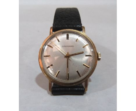A 9ct Garrard gentleman's wristwatch, the frosted dial with baton numerals and sweep seconds. 35mm diam. over crown. Back eng
