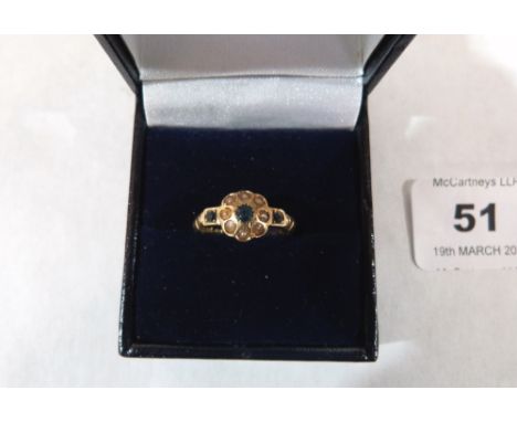 A Victorian sapphire and split pearl ring. In gold marked 18. 2.1g gross. Size N