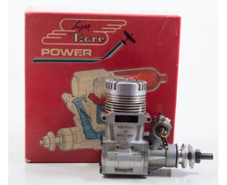 Two R/C glows, one SUPER TIGRE 61 ring, and one OS 25FP, both boxed, used (2)