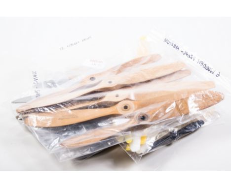 Eight bags containing props and R/C accessories