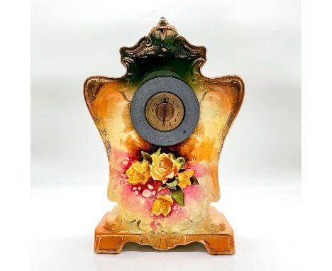 A beautiful clock adorned with yellow roses and gilded gold accents. Dimensions: 7"L x 3"W x 11.5"HCondition: Age related wea