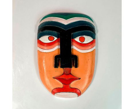 Hand carved and hand painted face with red eyes. Inspired by Aztec or perhaps the Mayan culture. Artist signed on the lower f