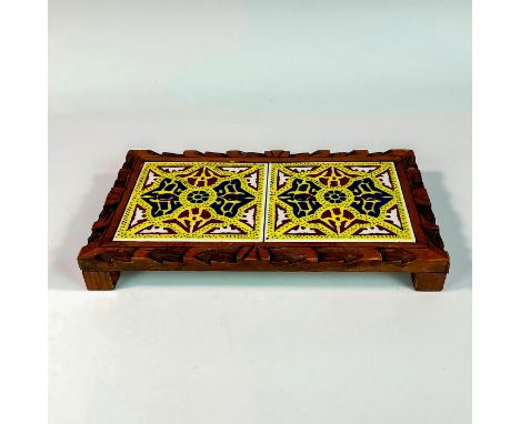 A beautiful yellow, blue, and tawny-brown ceramic tiles placed in a hand carved wooden base. 'Deal Standard Mexico' embossed 