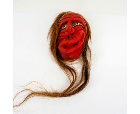 Wood carved mask painted red with metal eye decoration and horsehair. False Face masks can be painted red or black. The masks