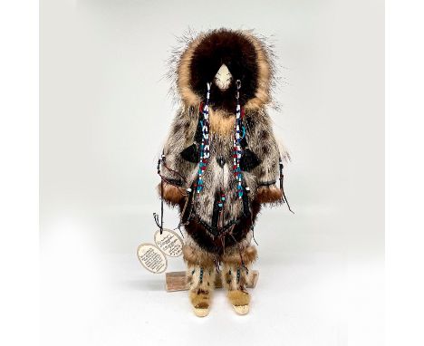 Handmade doll with detailed beadwork and wearing traditional garment. Certificate of Authenticity included. This item has a b