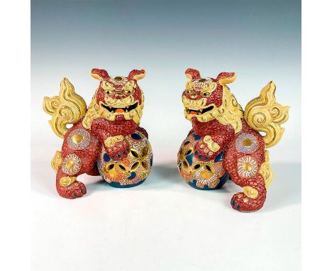 Vintage foo dogs playing with floral balls, decorated in enamel and gold gilt. Kutani gold stickers on the bases. Dimensions: