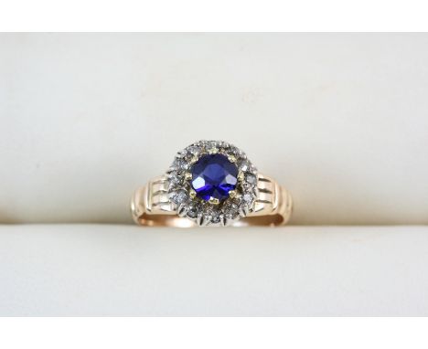 A VICTORIAN SAPPHIRE AND DIAMOND CLUSTER RING the circular-cut sapphire is set within a surround of rose-cut diamonds, in sil