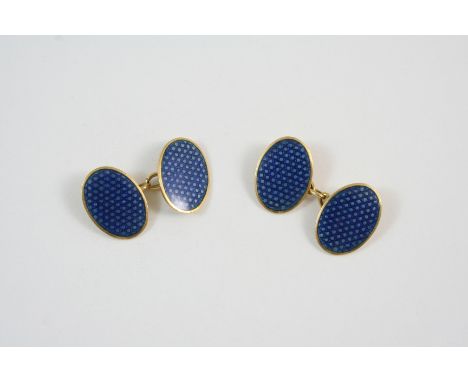 A PAIR OF 18CT. GOLD CUFFLINKS each link set with an oval section of blue enamel, 10 grams.