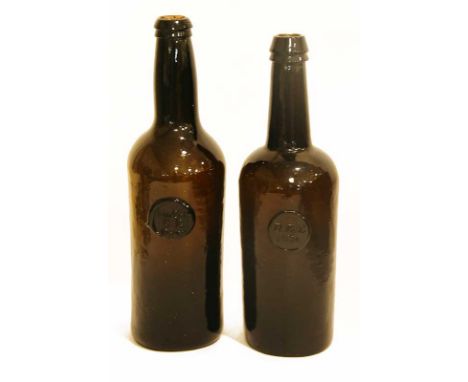 TWO SEALED WINE BOTTLES of brownish green metal with seal DBD 1836 and Lin Col C R Oxon 11.75" (30cm)