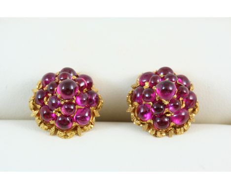 A PAIR OF RUBY AND GOLD CLUSTER EARRINGS of dome shape, each set with a cluster of cabochon rubies in gold. With post fitting