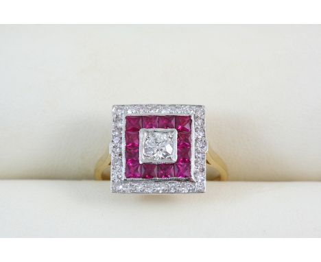 A RUBY AND DIAMOND CLUSTER RING centred with a circular-cut diamond within a surround of calibre-cut rubies and circular-cut 