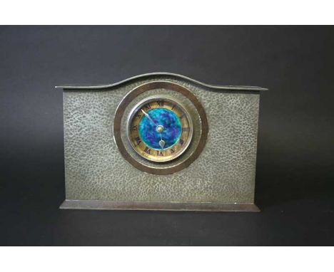 LIBERTY & CO MANTEL CLOCK with an enamel dial and hand beaten pewter case. Impressed marks, Liberty & Co, 01126, English Pewt