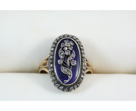 A GEORGIAN ENAMEL AND DIAMOND RING the oval central section of blue enamel with embossed floral decoration set with rose-cut 