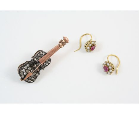 A PAIR OF RUBY AND PEARL CLUSTER EARRINGS each set with an oval-shaped ruby within a surround of small pearls, 0.75cm. dia., 