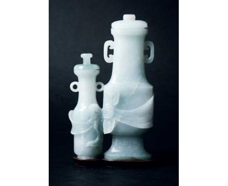 JADE a carved pale greenish grey group of two vases with covers height 6" (15cm) on a wood stand