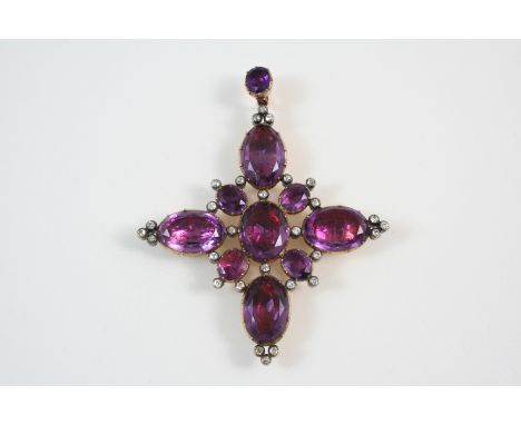 A GEORGIAN AMETHYST AND DIAMOND CRUCIFORM PENDANT formed with graduated oval shaped foil backed amethysts in gold closed back