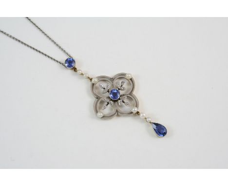 AN EARLY 20TH CENTURY SAPPHIRE, DIAMOND AND PEARL PENDANT of foliate form, set with two circular-cut sapphires, small pearls 