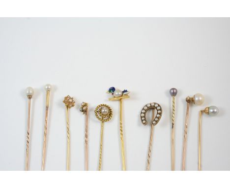 NINE ASSORTED STICK PINS including one set with an enamel duck and a small pearl, one formed as a pearl set horseshoe.