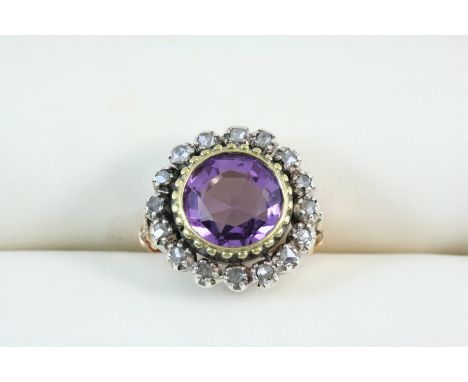 AN EARLY VICTORIAN AMETHYST AND DIAMOND CLUSTER RING the circular-cut amethyst is set within a surround of rose-cut diamonds,