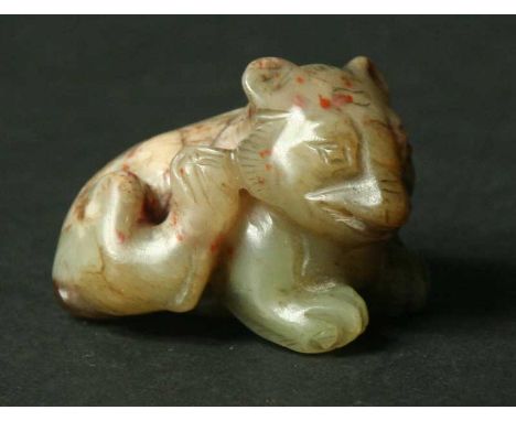 A CHINESE YELLOW JADE CARVED FIGURE of a tiger 1.5" (3.5cm)