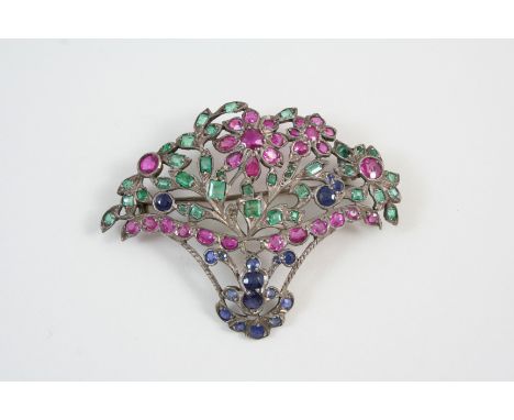 A RUBY, EMERALD AND SAPPHIRE GIARDINETTO BROOCH formed as a basket of flowers, the openwork design is set with rubies, emeral