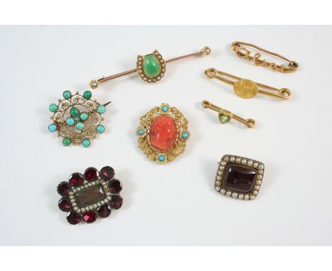 A GEORGIAN GARNET AND PEARL BROOCH the rectangular cabochon garnet set within a surround of small pearls, in gold, a Georgian