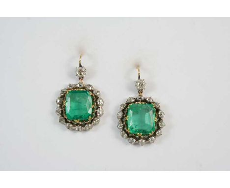 A PAIR OF EMERALD AND DIAMOND CLUSTER DROP EARRINGS each set with a cushion-shaped emerald within a surround of rose-cut diam