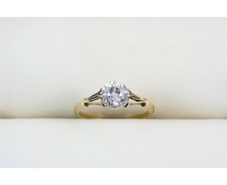 A DIAMOND SOLITAIRE RING set with an old brilliant-cut diamond, in gold. Size K.