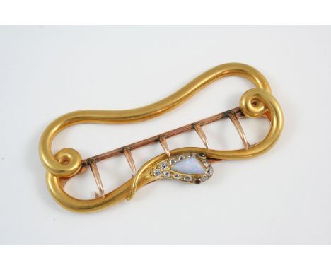 A VICTORIAN GOLD BUCKLE in the form of a snake, the head set with a cabochon opal within a surround of cushion-shaped diamond