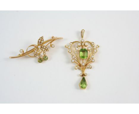 AN EDWARDIAN PERIDOT AND PEARL PENDANT the openwork design is centred with an octagonal-shaped peridot within a surround of g
