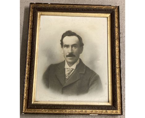 A large framed and glazed photographic portrait of a moustached gentleman.  Period frame with gilt detail.  Frame approx. 63c