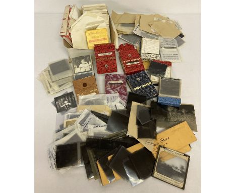 A box of assorted vintage photographic negatives.  