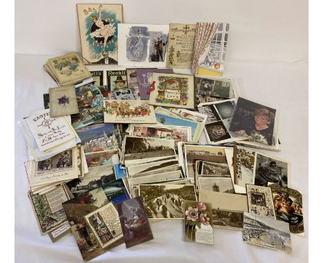 A quantity of assorted vintage and modern greetings cards and postcards.  
