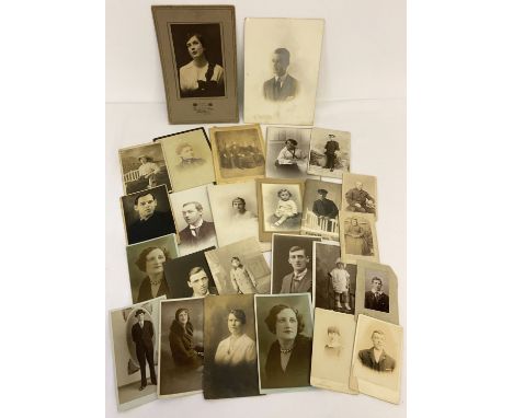 A small collection of antique and vintage photographic portraits and cabinet cards.  