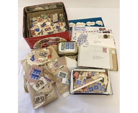 A tin of vintage used and unused British and world stamps and first day covers.   Selling on behalf of a private estate.