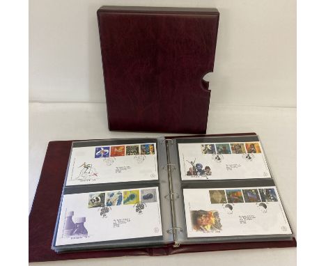 A burgundy Royal Mail First Day Covers binders containing 68 Covers, dating from 1995 -2001.  To include: Football Legends, T