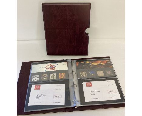 A set of 12 Royal Mail Millennium 4 stamp Presentation packs, for each month of the year.  Contained in a Royal Mail First Da