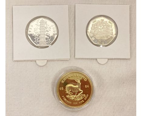 3 Novelty / copies of coins. A 2019 Brexit 50p coin, Kew Gardens 50p and a Krugerrand.  