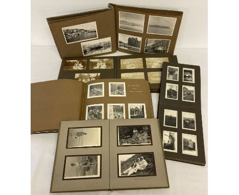 A collection of vintage photograph albums containing images from the 1920's and 1950's.  