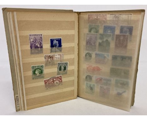 A small vintage album containing antique and vintage postage stamps, mostly unused.  To include Victorian, George V, VI and E