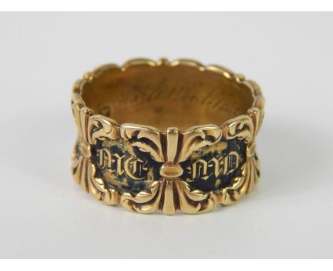 A William IV 18ct gold and black enamel mourning ring, decorated to the outside with leaves and reserves In Memory of, intern
