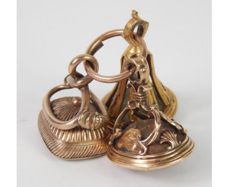 Three 18/19thC yellow metal and hard stone set fob seals, one set with an oval Cornelian intaglio of a marriage coat of arms,